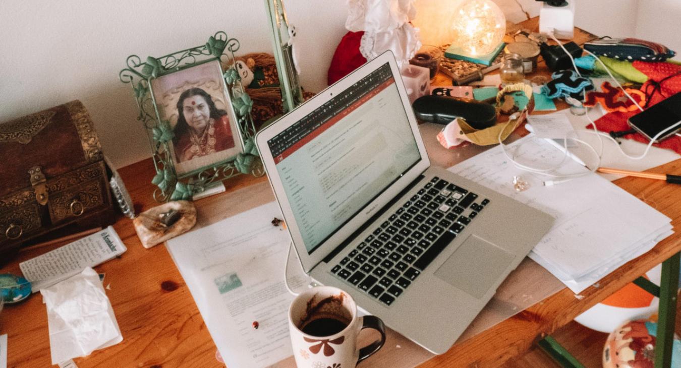 laptop beside coffee cup