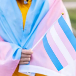 trans youth with flag